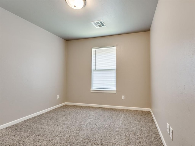 2208 Rivera Rd, Yukon, OK 73099 - carpeted spare room featuring baseboards