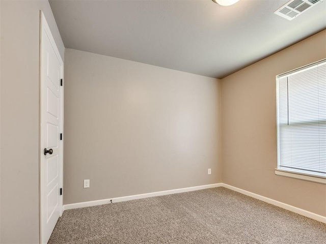 2208 Rivera Rd, Yukon, OK 73099 - spare room featuring carpet flooring and plenty of natural light