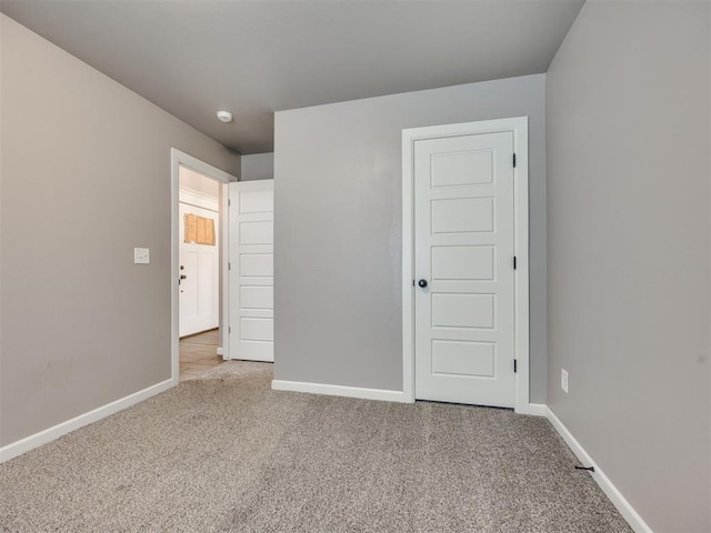 2208 Rivera Rd, Yukon, OK 73099 - unfurnished bedroom featuring carpet flooring and baseboards