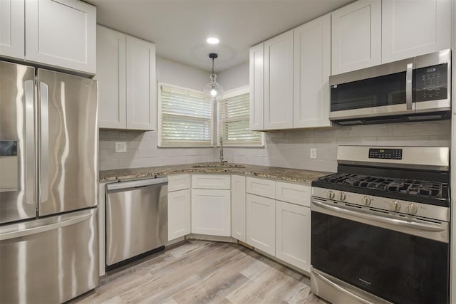 1627 Sheffield Rd, Oklahoma City, OK 73120 - kitchen with stainless steel appliances, white cabinetry, light stone countertops, and recessed lighting
