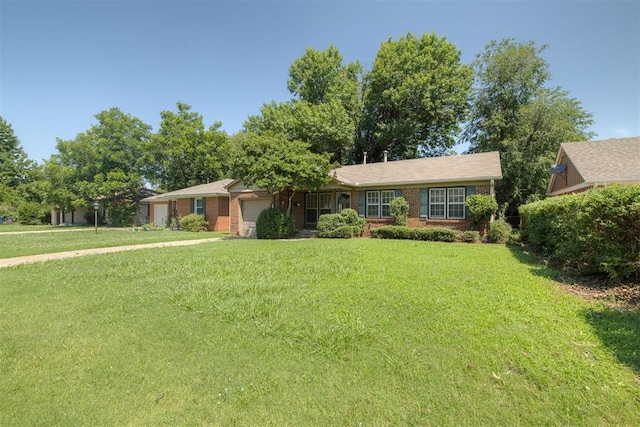 1627 Sheffield Rd, Oklahoma City, OK 73120 - ranch-style house with a garage, a front lawn, and brick siding