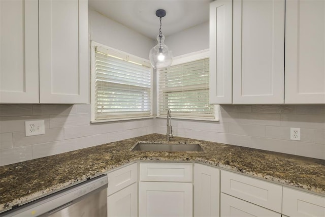 1627 Sheffield Rd, Oklahoma City, OK 73120 - kitchen featuring stainless steel dishwasher, white cabinetry, and backsplash