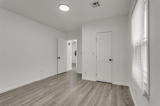 1617 NW 31st St, Oklahoma City, OK 73118 - unfurnished bedroom with light wood-style floors and baseboards