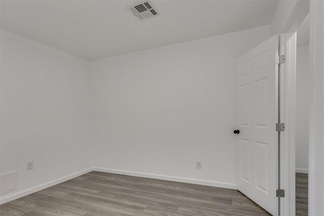 1617 NW 31st St, Oklahoma City, OK 73118 - empty room with wood finished floors and baseboards