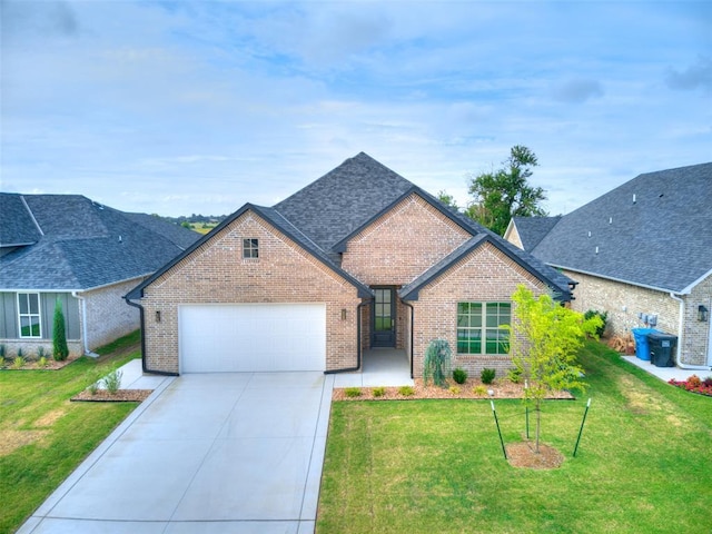 208 Pont Neuf Ct, Edmond, OK 73034 - french country inspired facade with brick siding, an attached garage, concrete driveway, and a front lawn