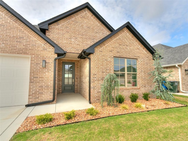 208 Pont Neuf Ct, Edmond, OK 73034 - view of front of home with brick siding and a garage