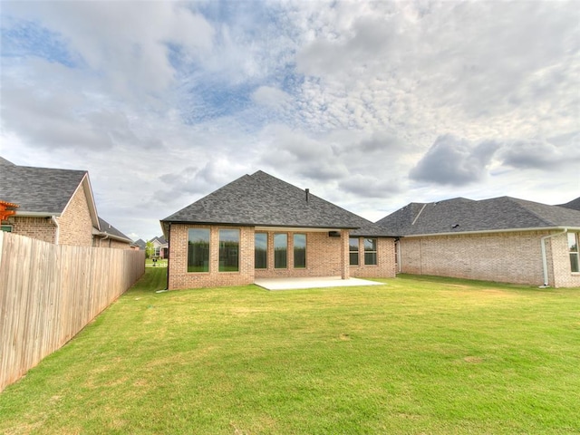 208 Pont Neuf Ct, Edmond, OK 73034 - back of house with brick siding, a patio, and roof with shingles