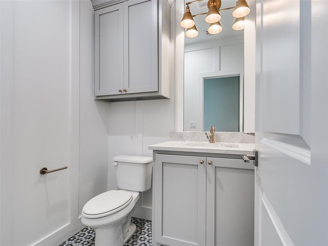 208 Pont Neuf Ct, Edmond, OK 73034 - bathroom with vanity and a chandelier