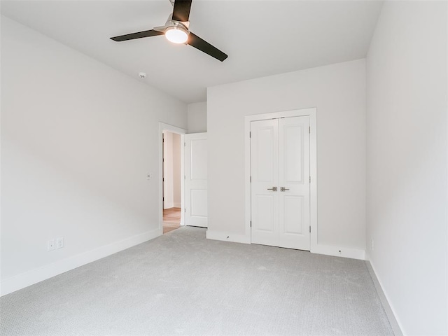208 Pont Neuf Ct, Edmond, OK 73034 - unfurnished bedroom with carpet flooring, a closet, and ceiling fan