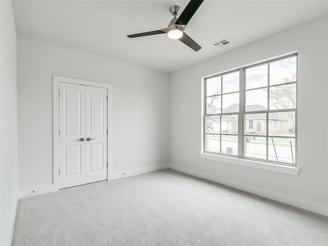 208 Pont Neuf Ct, Edmond, OK 73034 - unfurnished bedroom featuring carpet, a closet, and ceiling fan