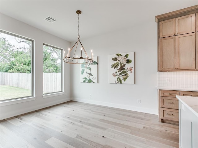 208 Pont Neuf Ct, Edmond, OK 73034 - unfurnished dining area featuring a chandelier and light wood-type flooring