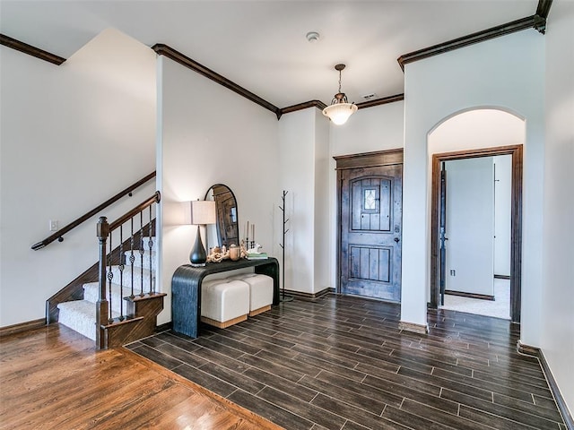 3205 NW 192nd Ter, Edmond, OK 73012 - entryway with crown molding, wood finished floors, arched walkways, and stairs