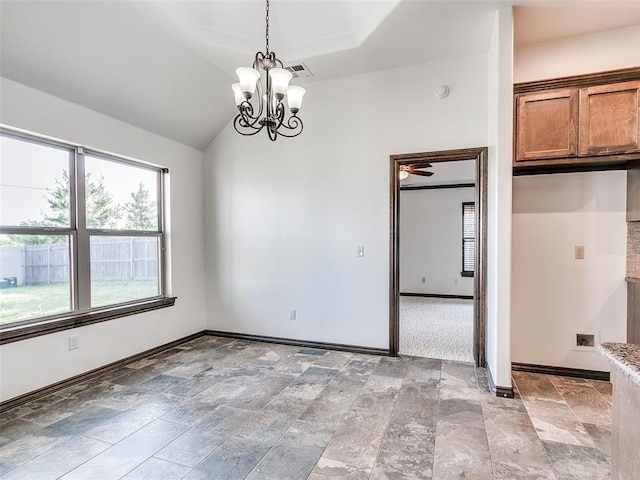 3205 NW 192nd Ter, Edmond, OK 73012 - unfurnished dining area featuring healthy amount of natural light, a chandelier, light stone finish floors, and a tray ceiling