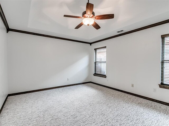 3205 NW 192nd Ter, Edmond, OK 73012 - carpeted empty room featuring ornamental molding, a ceiling fan, and a tray ceiling