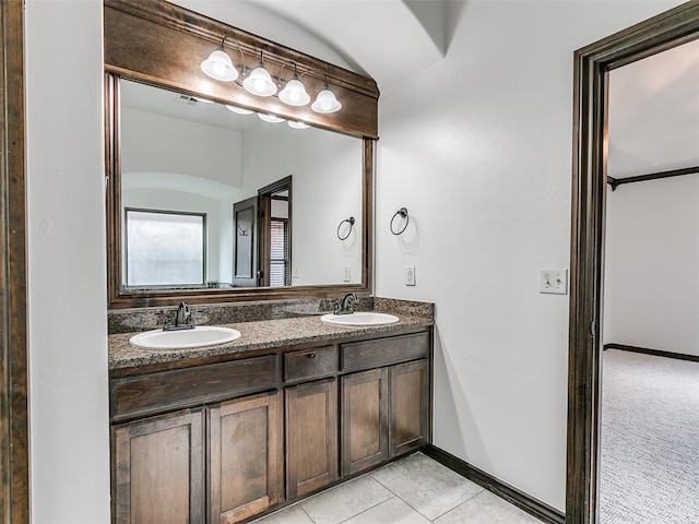 3205 NW 192nd Ter, Edmond, OK 73012 - bathroom with double vanity, tile patterned floors, and vaulted ceiling