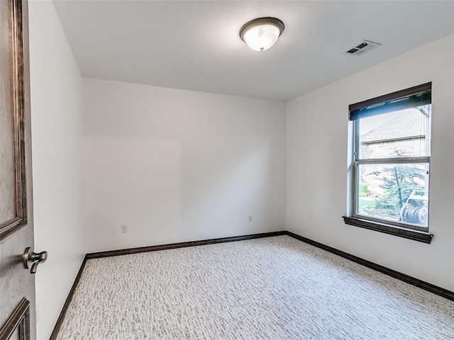 3205 NW 192nd Ter, Edmond, OK 73012 - empty room featuring light colored carpet and baseboards