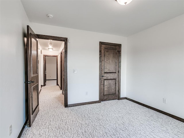 3205 NW 192nd Ter, Edmond, OK 73012 - unfurnished bedroom with light carpet and baseboards