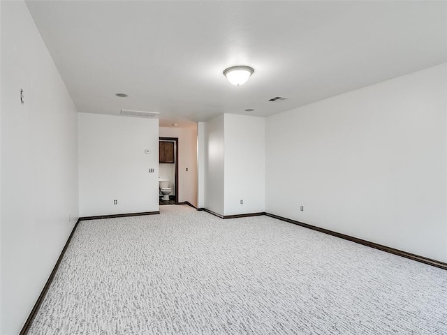 3205 NW 192nd Ter, Edmond, OK 73012 - spare room with light colored carpet and baseboards