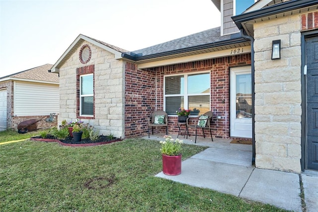 1621 Tumbleweed Way, El Reno, OK 73036 - view of home's exterior featuring a lawn, brick siding, roof with shingles, and stone siding