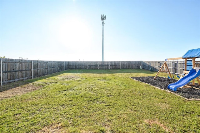1621 Tumbleweed Way, El Reno, OK 73036 - fenced backyard featuring a playground