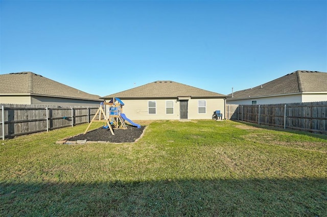 1621 Tumbleweed Way, El Reno, OK 73036 - back of house with a playground and a fenced backyard