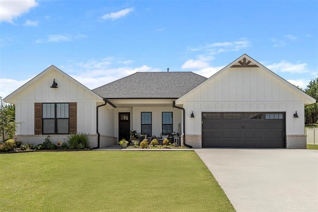 2666 Legacy Pl, Shawnee, OK 74804 - modern farmhouse featuring concrete driveway, a garage, a front lawn, and board and batten siding