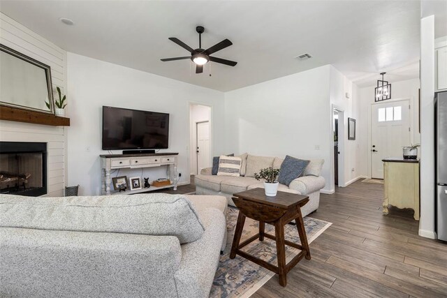 2666 Legacy Pl, Shawnee, OK 74804 - living room featuring a ceiling fan, dark wood-style flooring, and a large fireplace