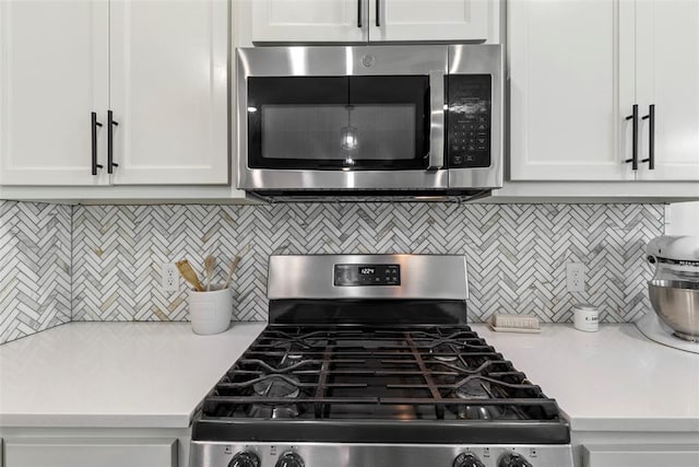 2666 Legacy Pl, Shawnee, OK 74804 - kitchen featuring stainless steel appliances, light countertops, backsplash, and white cabinets