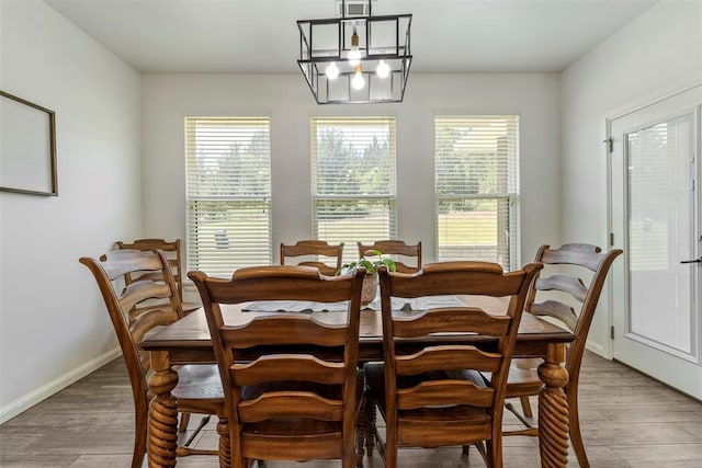2666 Legacy Pl, Shawnee, OK 74804 - dining area featuring a chandelier and light wood-style floors