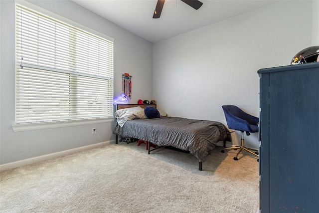 2666 Legacy Pl, Shawnee, OK 74804 - carpeted bedroom featuring multiple windows and a ceiling fan