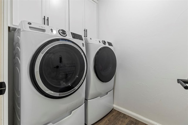 2666 Legacy Pl, Shawnee, OK 74804 - laundry room with cabinet space, washer and dryer, and dark wood finished floors