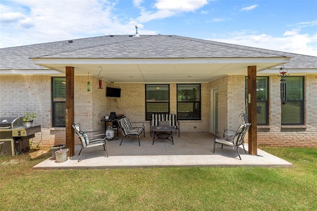 2666 Legacy Pl, Shawnee, OK 74804 - back of house with roof with shingles, a patio area, and brick siding