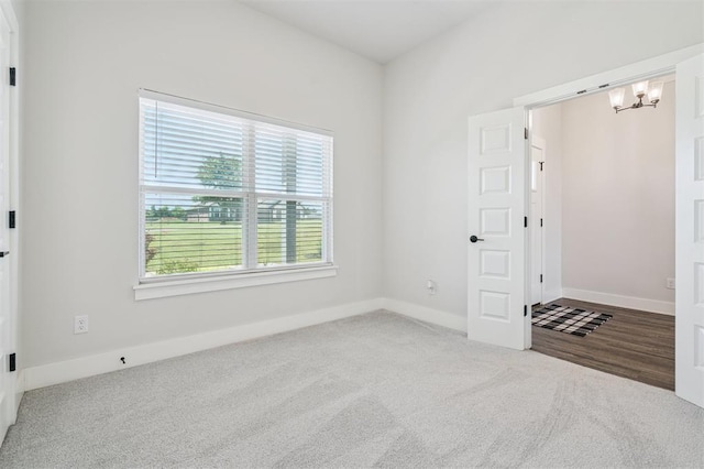 2316 Dixie Dr, Blanchard, OK 73010 - unfurnished bedroom with carpet and a chandelier