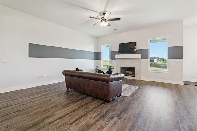 2316 Dixie Dr, Blanchard, OK 73010 - living room with dark wood-style flooring, ceiling fan, and a fireplace
