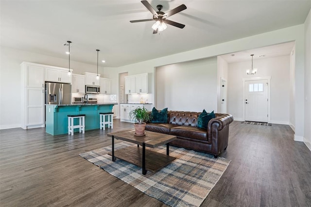 2316 Dixie Dr, Blanchard, OK 73010 - living area with dark wood finished floors, a ceiling fan, and recessed lighting