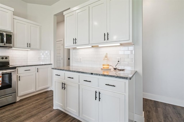 2316 Dixie Dr, Blanchard, OK 73010 - kitchen with stainless steel appliances, stone counters, dark wood finished floors, and white cabinetry