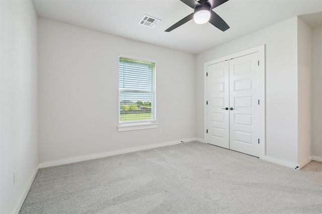 2316 Dixie Dr, Blanchard, OK 73010 - unfurnished bedroom featuring carpet flooring, a closet, and a ceiling fan