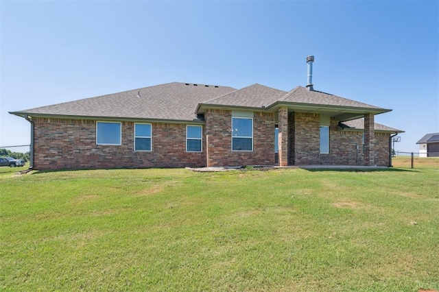 2316 Dixie Dr, Blanchard, OK 73010 - rear view of house with brick siding and roof with shingles