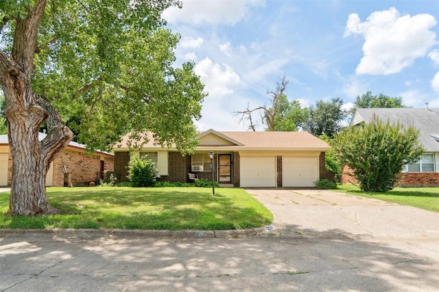 720 NW 16th St, Moore, OK 73160 - ranch-style home with brick siding, a garage, concrete driveway, and a front lawn