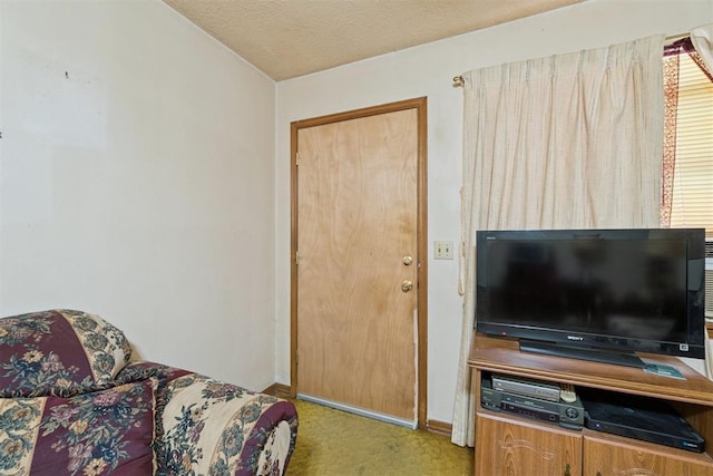 720 NW 16th St, Moore, OK 73160 - carpeted living area with baseboards and a textured ceiling