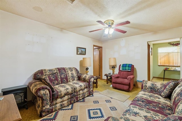 720 NW 16th St, Moore, OK 73160 - carpeted living room with ceiling fan and a textured ceiling