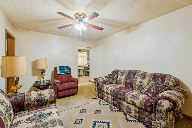 720 NW 16th St, Moore, OK 73160 - living room with ceiling fan and a textured ceiling