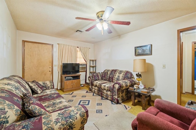720 NW 16th St, Moore, OK 73160 - living room with ceiling fan and a textured ceiling