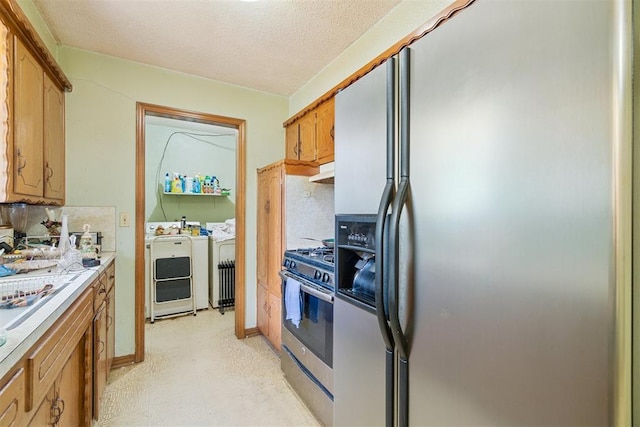 720 NW 16th St, Moore, OK 73160 - kitchen with refrigerator with ice dispenser, washer and clothes dryer, stainless steel gas stove, decorative backsplash, and light countertops