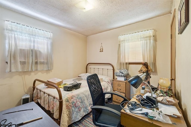 720 NW 16th St, Moore, OK 73160 - bedroom with a textured ceiling