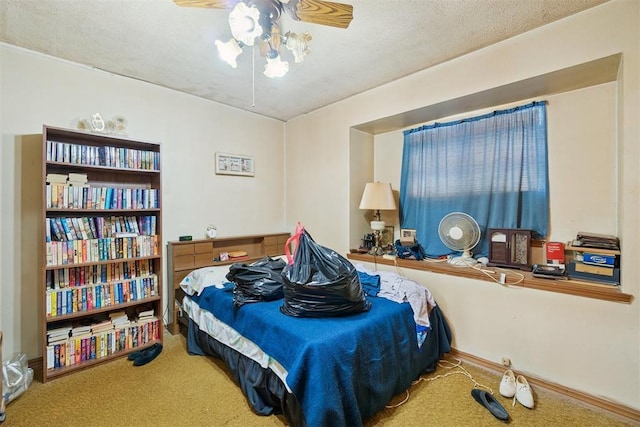 720 NW 16th St, Moore, OK 73160 - bedroom featuring carpet floors, ceiling fan, and a textured ceiling