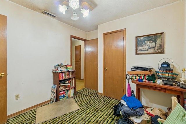 720 NW 16th St, Moore, OK 73160 - carpeted bedroom with baseboards and a ceiling fan