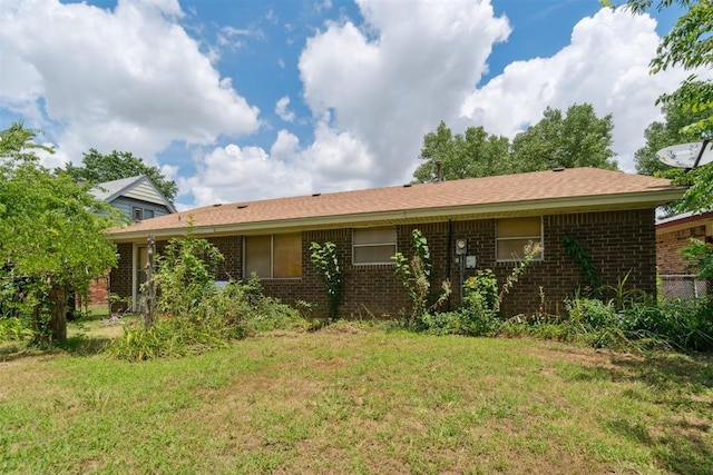 720 NW 16th St, Moore, OK 73160 - rear view of house featuring brick siding and a lawn