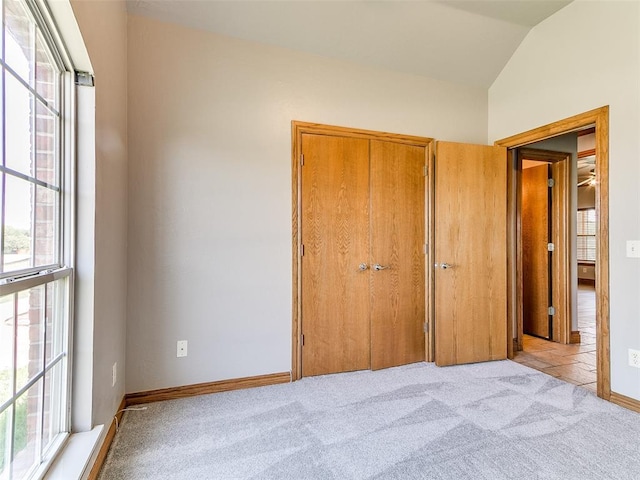 4813 SE 28th St, Oklahoma City, OK 73165 - bedroom with multiple windows, light carpet, a closet, and vaulted ceiling