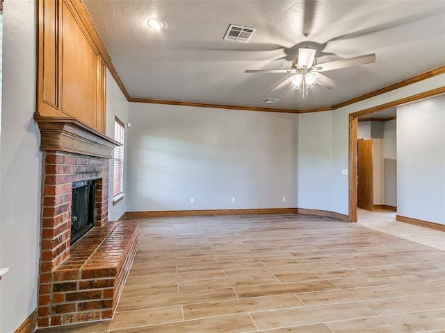 4813 SE 28th St, Oklahoma City, OK 73165 - unfurnished living room featuring crown molding, a brick fireplace, a ceiling fan, light wood-type flooring, and a textured ceiling